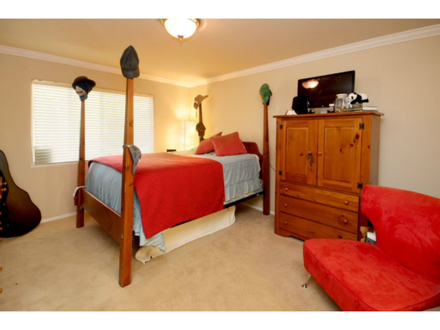 293 Arrowhead Way Scotts Valley, CA 95066 - Photo 11 of 25 a bedroom with a bed and a flat tv screen