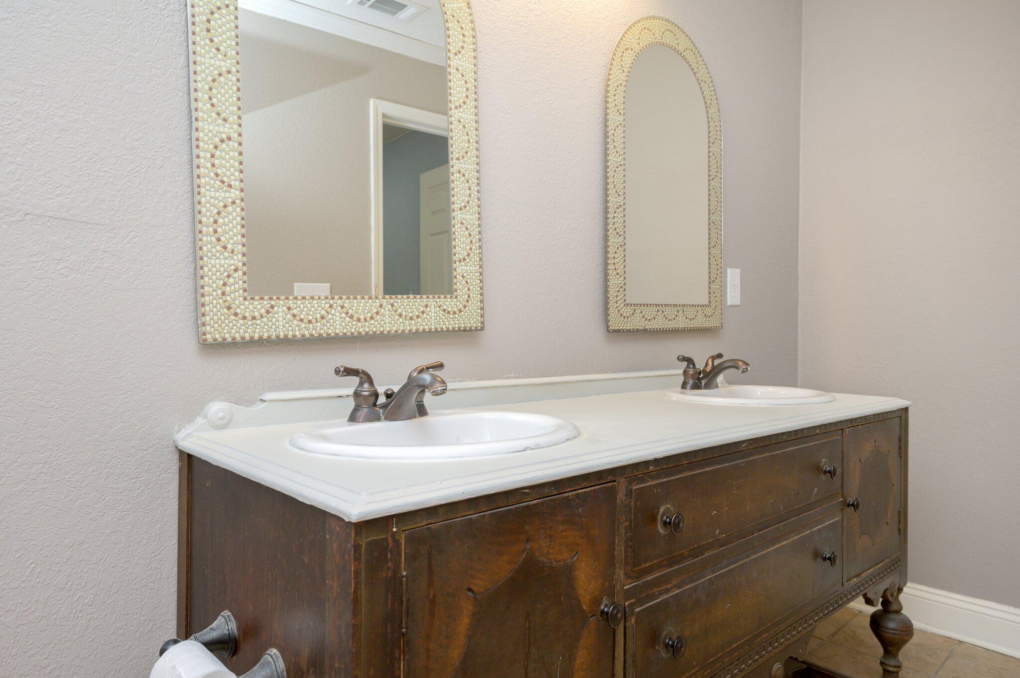 111 Sikes Drive Crestview, FL 32539 - Photo 13 of 46 a bathroom with a sink and a mirror