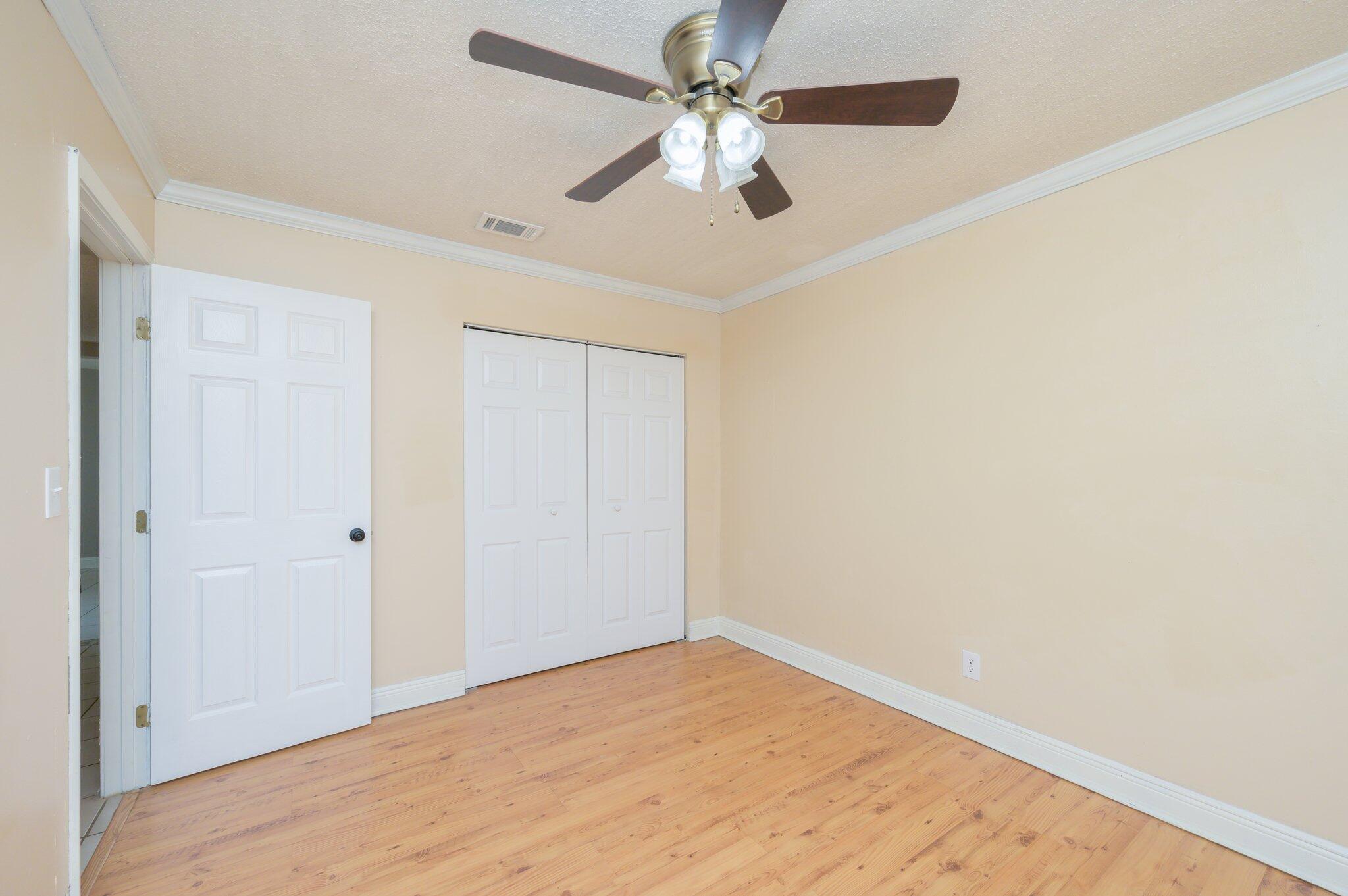 111 Sikes Drive Crestview, FL 32539 - Photo 27 of 46 wooden floor in an empty room
