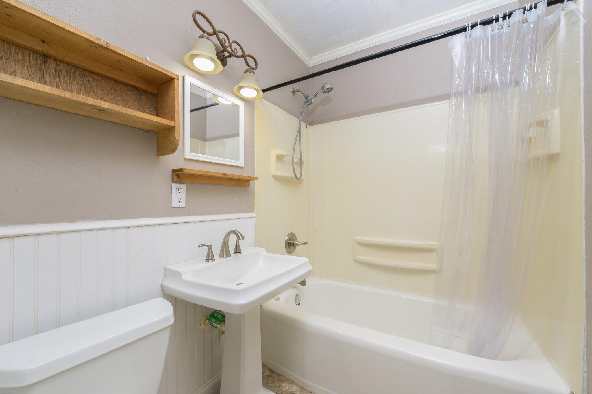 111 Sikes Drive Crestview, FL 32539 - Photo 30 of 46 a bathroom with a sink a toilet and shower