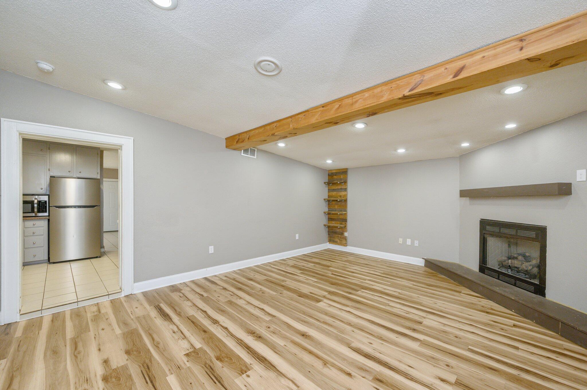 111 Sikes Drive Crestview, FL 32539 - Photo 3 of 46 a view of an empty room with a fireplace