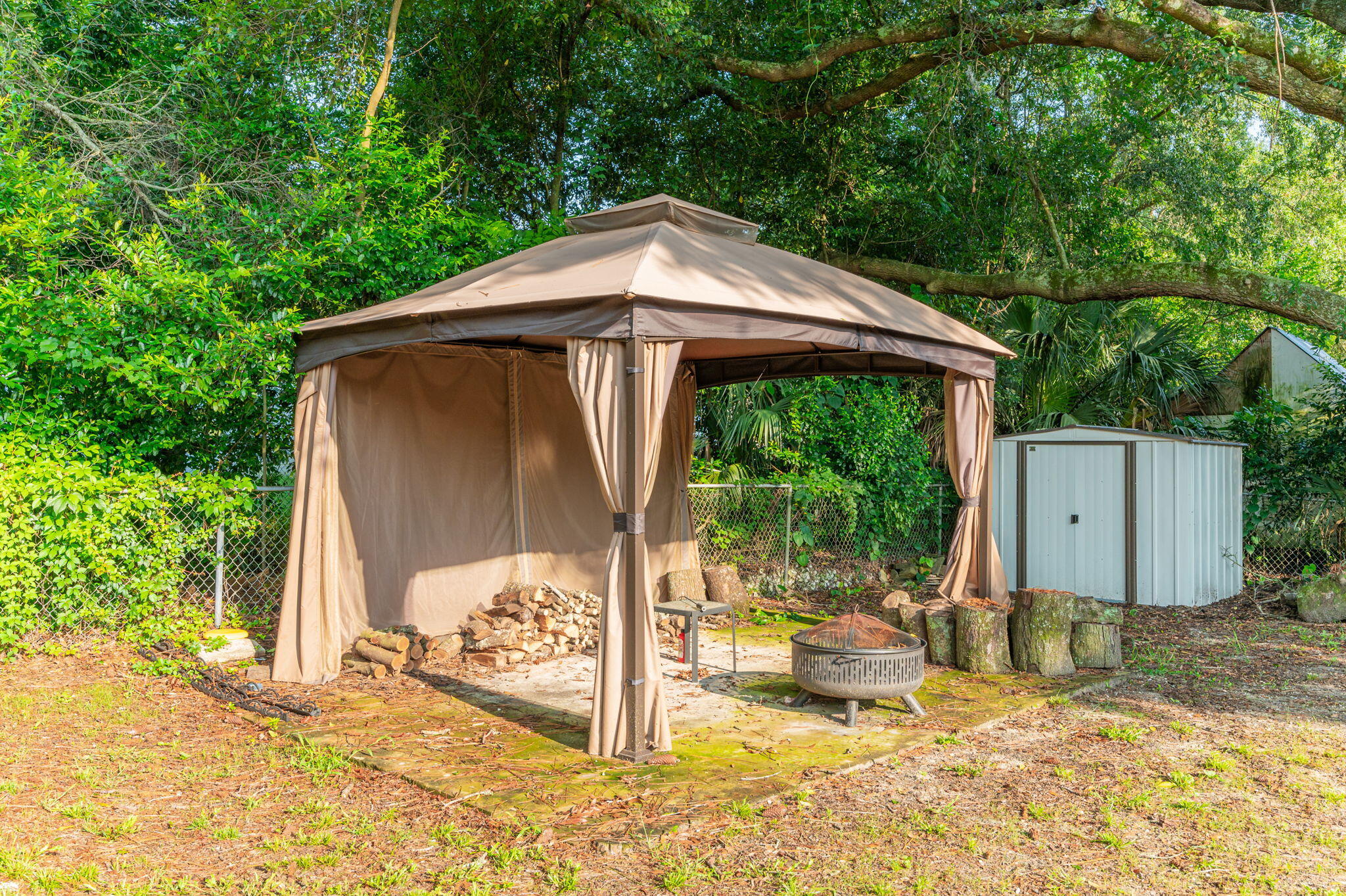 111 Sikes Drive Crestview, FL 32539 - Photo 37 of 46 a backyard of a house with table and chairs