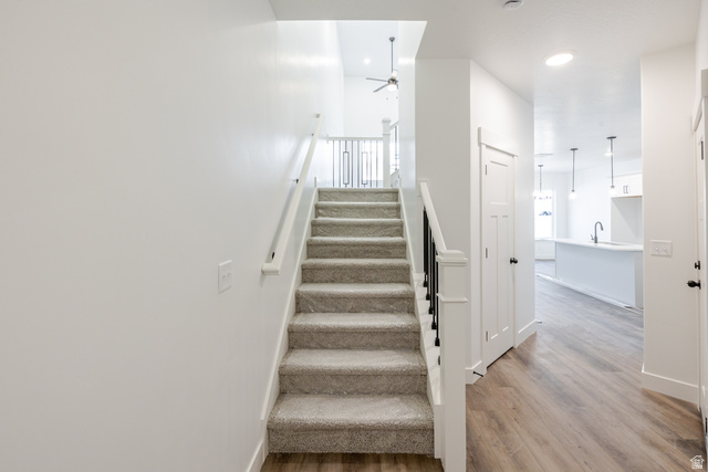 4775 Olive Avenue, Unit 412 Mapleton, UT 84664 - Photo 2 of 19 Stairway featuring wood finished floors, a ceiling fan, and recessed lighting