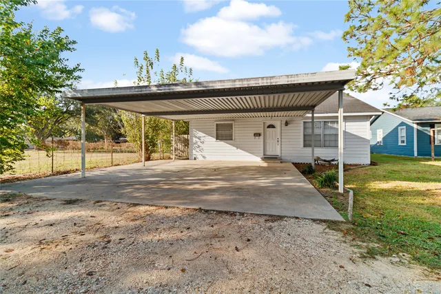 a view of a backyard with a patio
