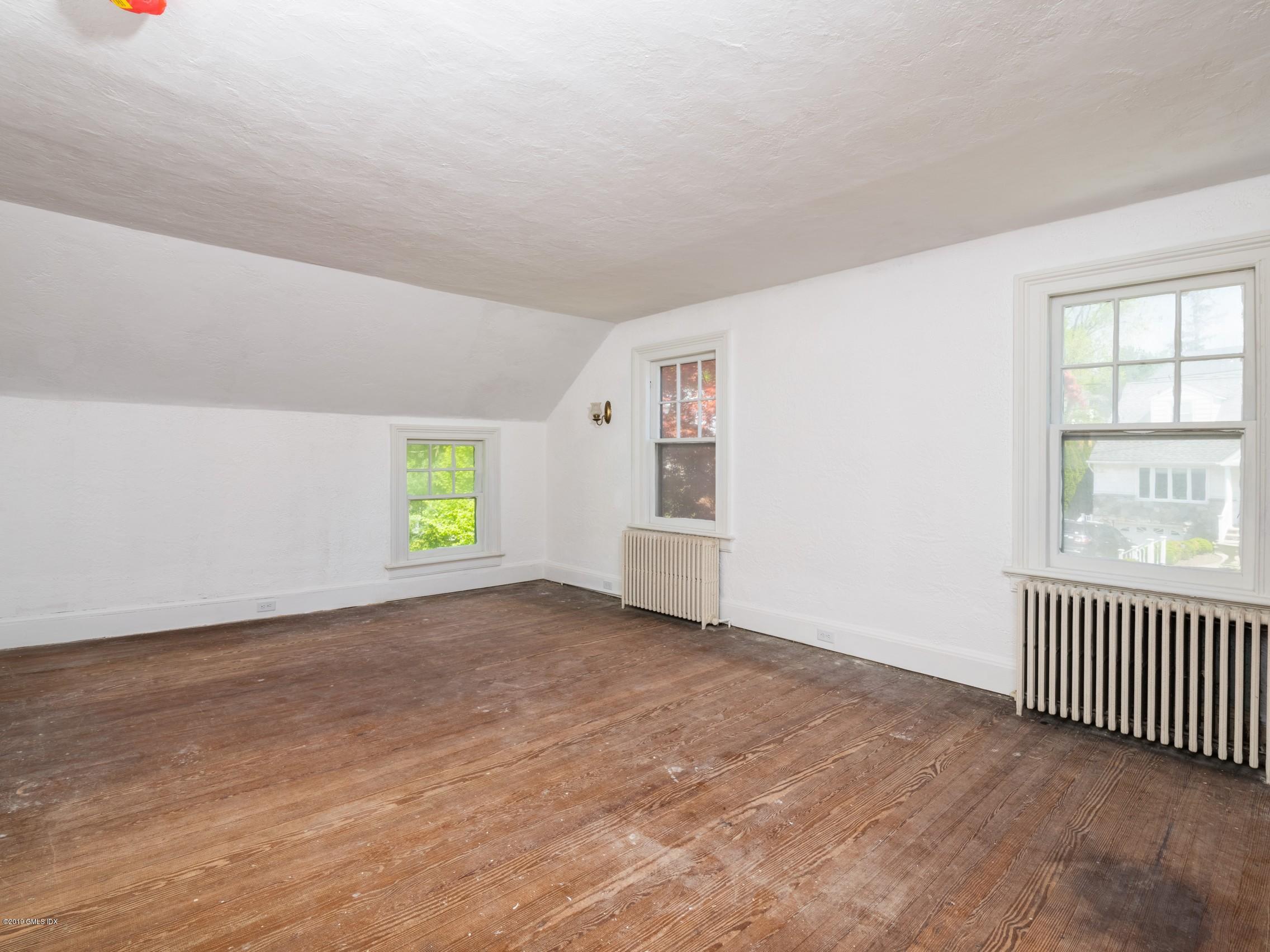 566 River Road Cos Cob, CT 06807 - Photo 11 of 22 an empty room with windows