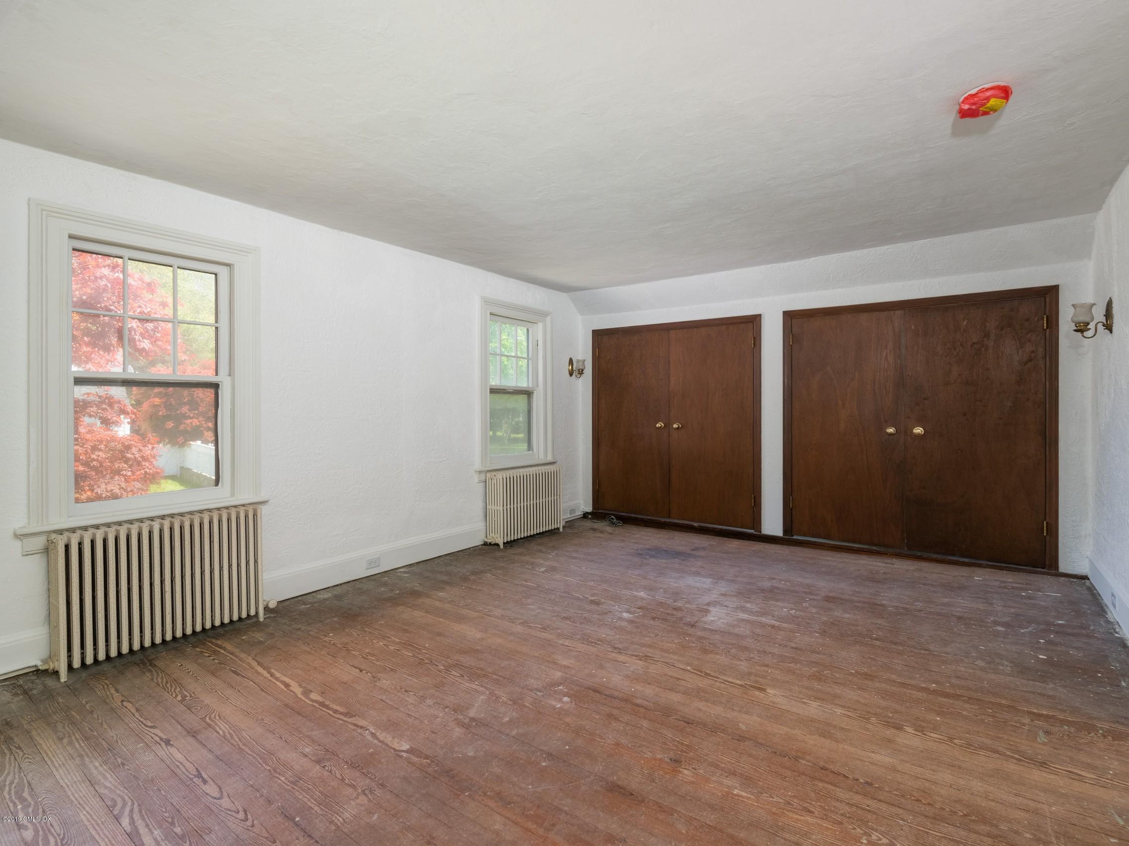 566 River Road Cos Cob, CT 06807 - Photo 10 of 22 an empty room with windows