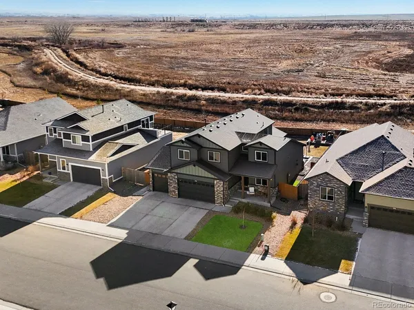 an aerial view of a house with a ocean view