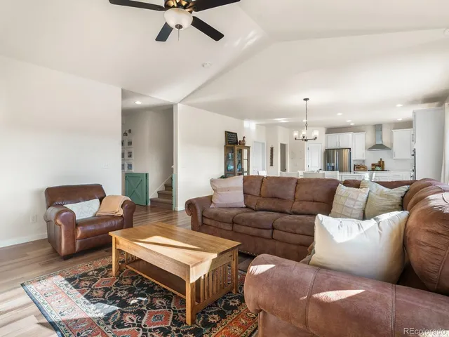 a living room with furniture and a rug
