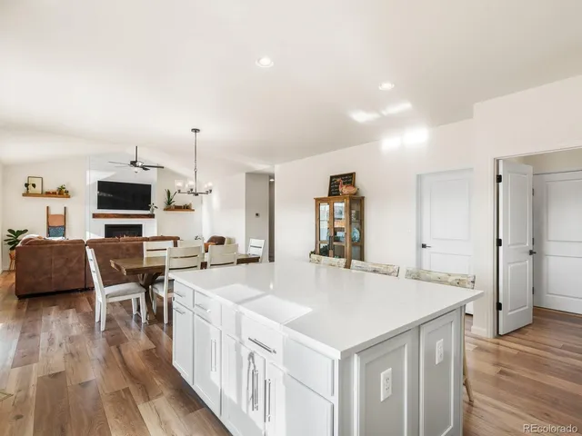 a kitchen with a sink a counter top space and stainless steel appliances