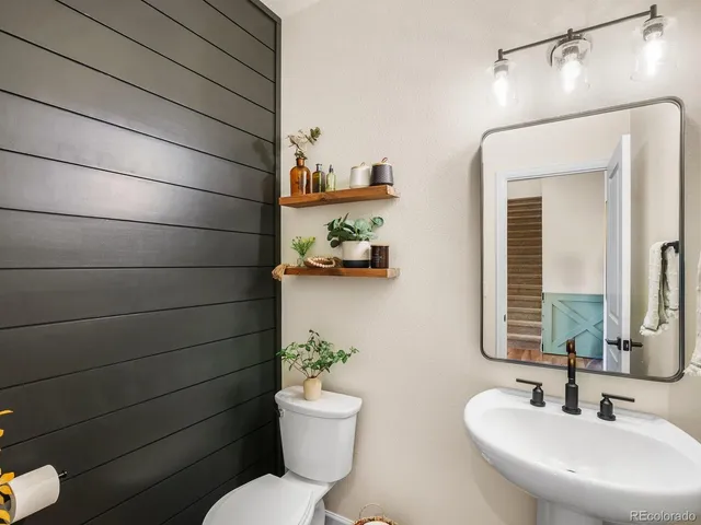 a bathroom with a toilet and a sink