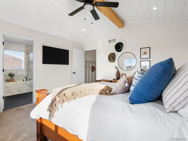 a bedroom with bed and tv