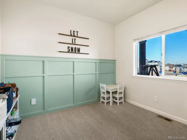 a room with a desk and chair