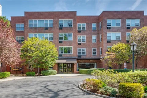 a front view of a multi story residential apartment building