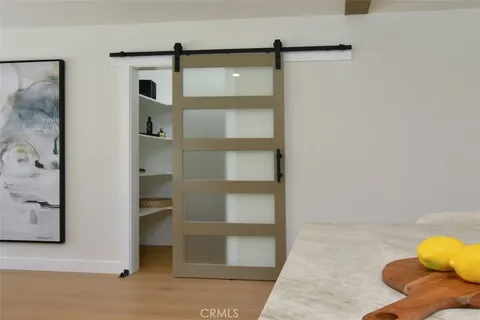 a kitchen with stainless steel appliances granite countertop a stove a sink and a wooden cabinets