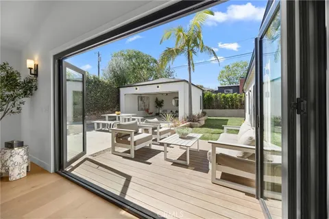 a living room with furniture a window and a fireplace