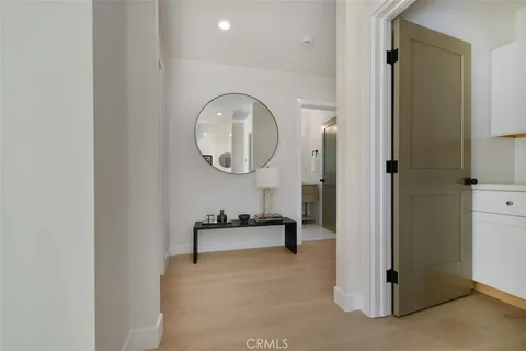 a view of a dining room with furniture and a chandelier