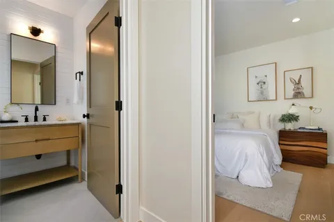 a spacious bedroom with a bed and window