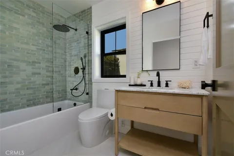 a en suite bathroom with a sink and a mirror
