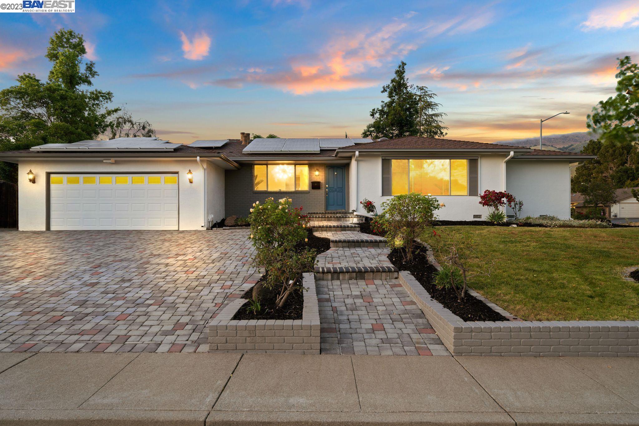 a front view of a house with garden