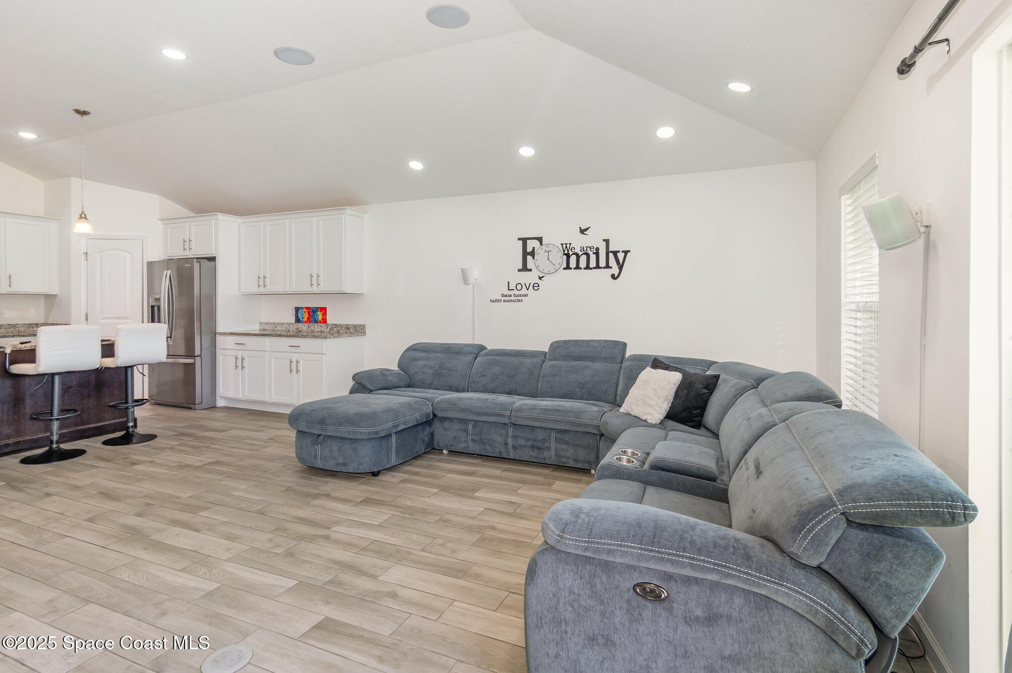 1534 Pine Street Orlando, FL 32824 - Photo 8 of 31 a living room with furniture and kitchen view