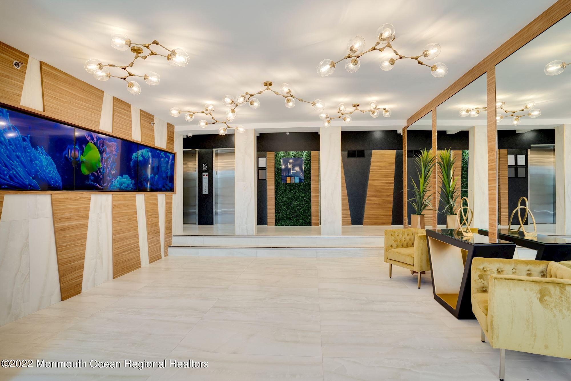 122 Bodman Place, Unit B5 Red Bank, NJ 07701 - Photo 23 of 29 a view of lobby with furniture and a large window