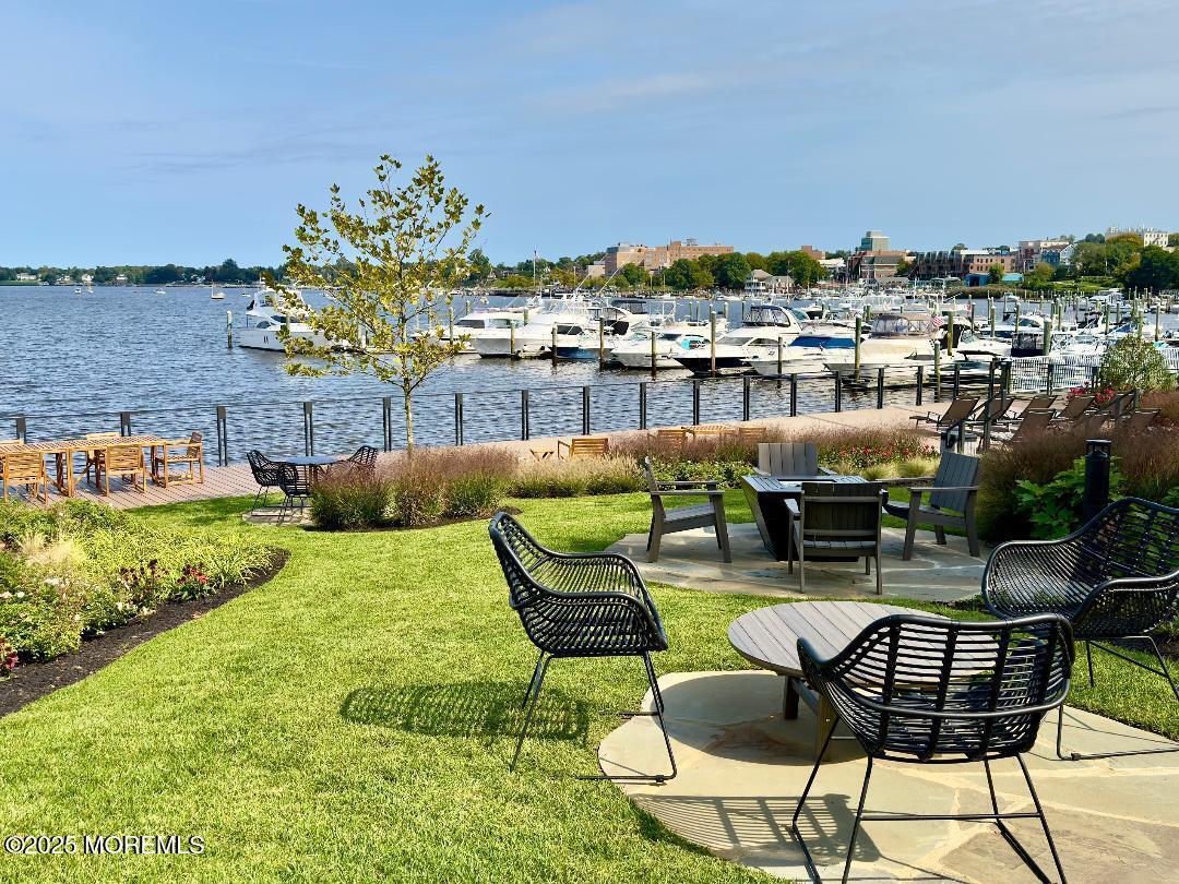 122 Bodman Place, Unit B5 Red Bank, NJ 07701 - Photo 24 of 29 a view of a chairs and table in the backyard