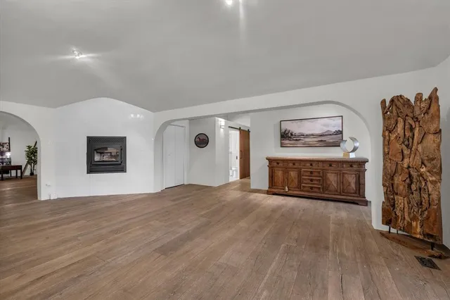 a kitchen with stainless steel appliances granite countertop a sink a stove and a refrigerator