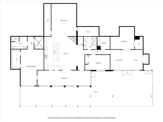 a balcony with couple of chairs and a couch