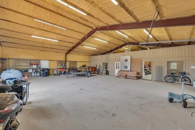 a kitchen with refrigerator and cabinets