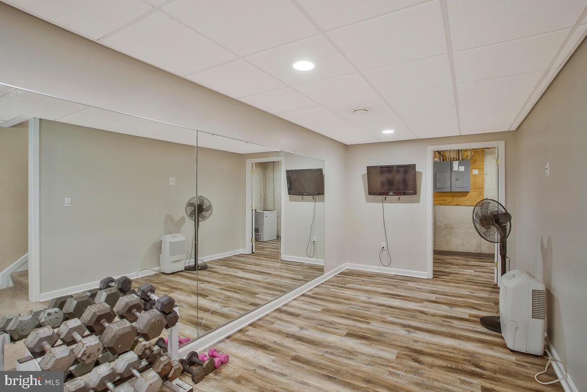 175-m F M F Bowen Road Huntingtown, MD 20639 - Photo 34 of 47 a bedroom with bed and mirror