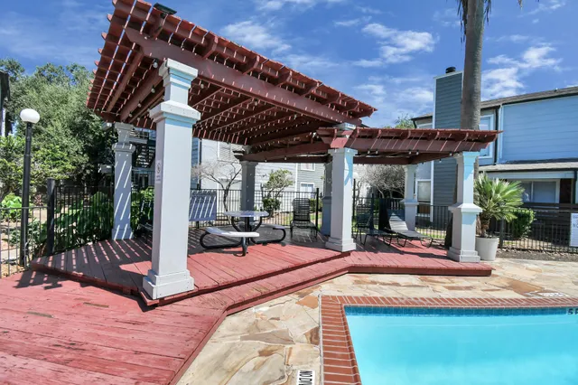 a kitchen with a sink stove and refrigerator