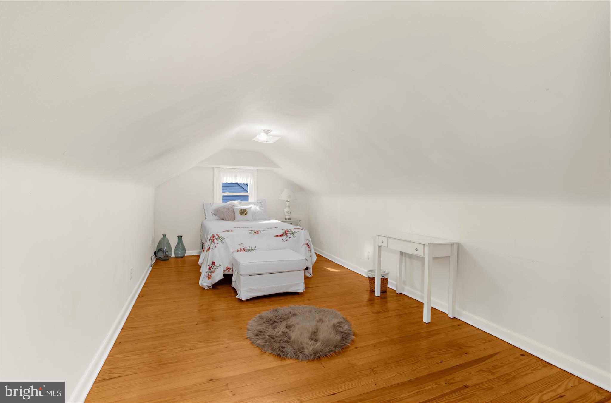 534 Cleveland Road Linthicum Heights, MD 21090 - Photo 18 of 30 a bedroom with a bed and wooden floor