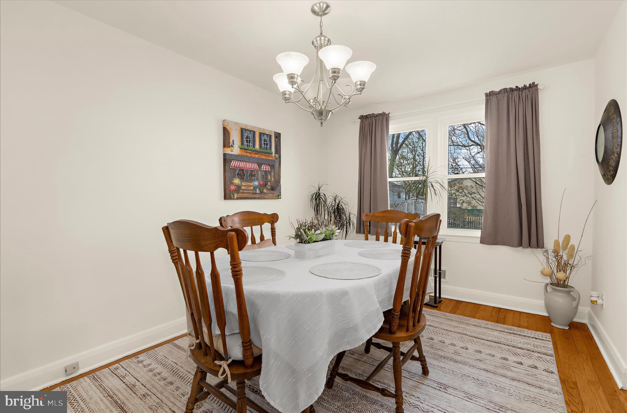 534 Cleveland Road Linthicum Heights, MD 21090 - Photo 5 of 30 a view of a dining room with furniture a chandelier and wooden floor