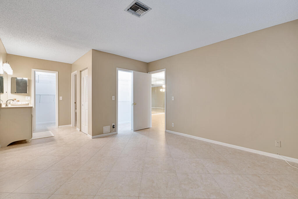 2411 Papaya Drive, Unit 202 Delray Beach, FL 33445 - Photo 13 of 23 a view of an empty room