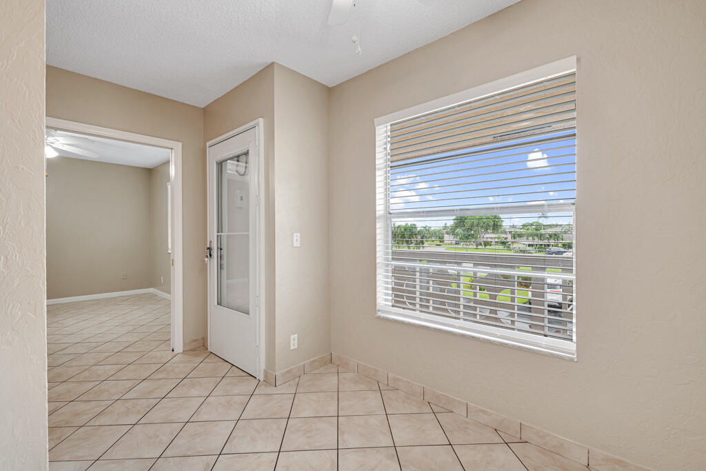 2411 Papaya Drive, Unit 202 Delray Beach, FL 33445 - Photo 2 of 23 a view of an empty room with window