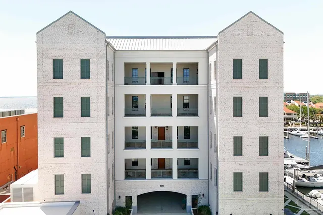 a front view of a building with a lot of windows