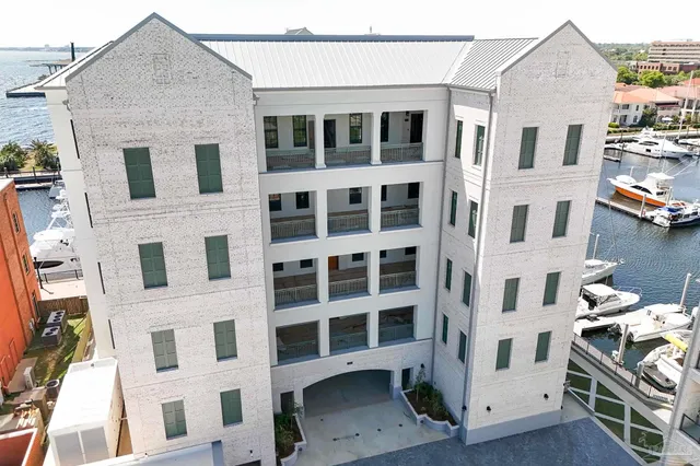 a front view of a building with many windows