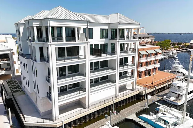 a front view of a building with a lot of windows