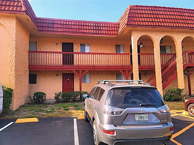 a front view of a house with swimming pool