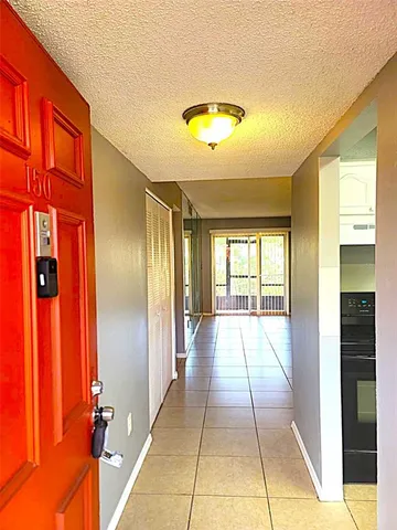 a kitchen with granite countertop cabinets appliances and a window