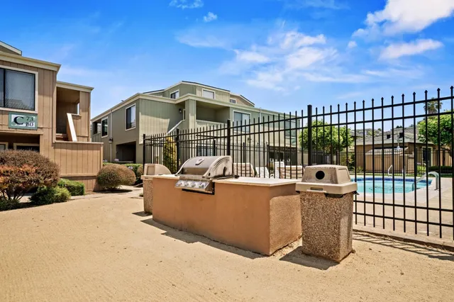 a view of a wrought iron fences in front of house