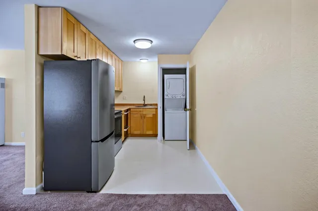a view of a kitchen with a refrigerator
