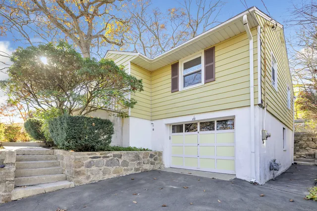 a view of a house with a tree