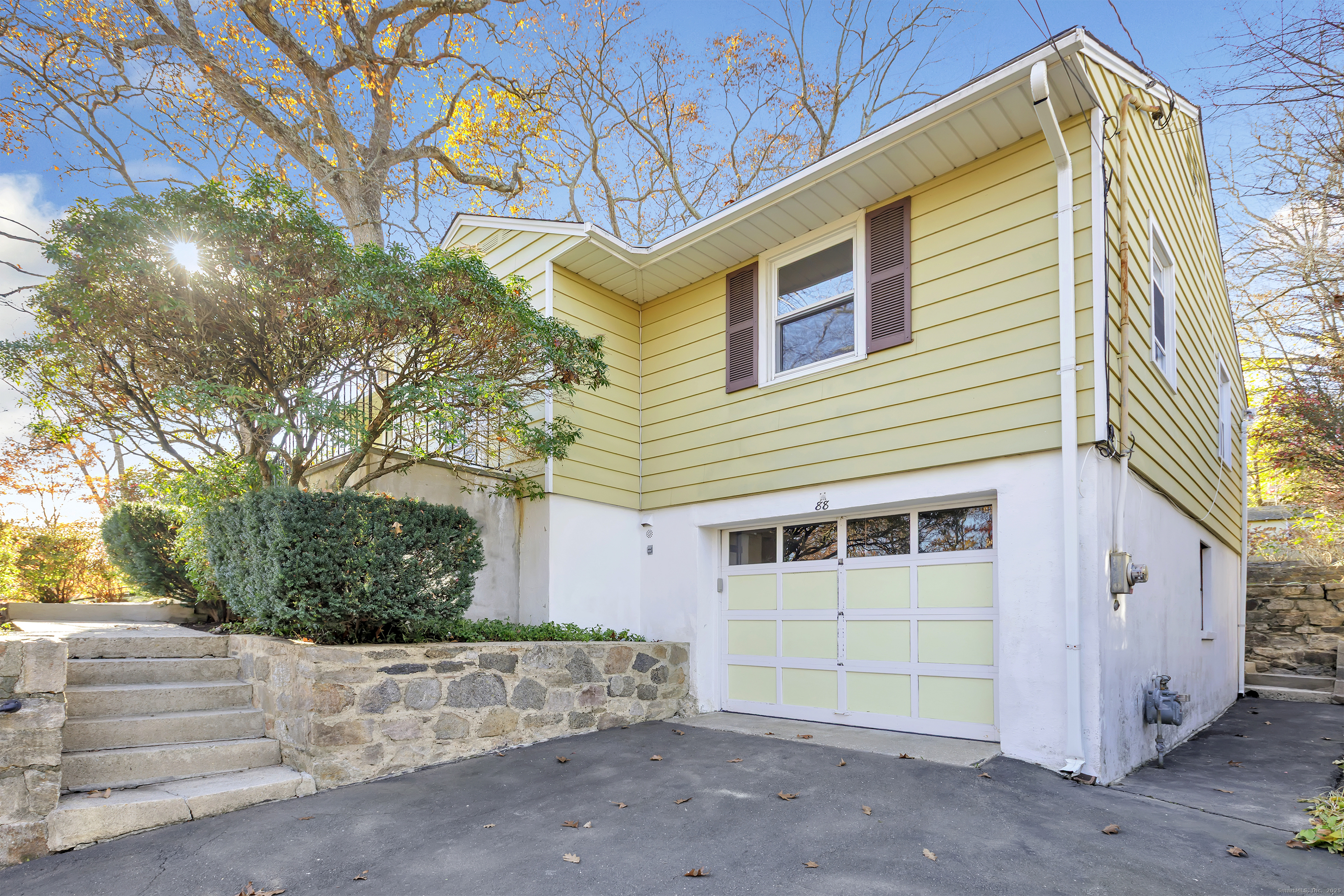 a view of a house with a tree