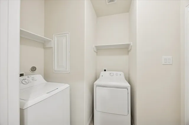a bathroom with a sink toilet vanity and shower
