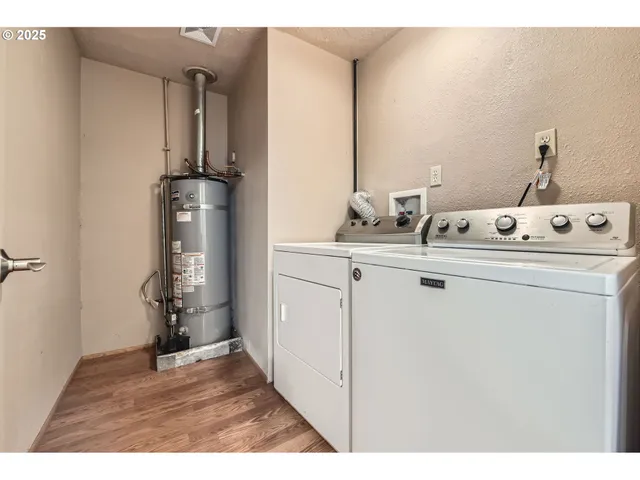 a utility room with closet dryer and washer