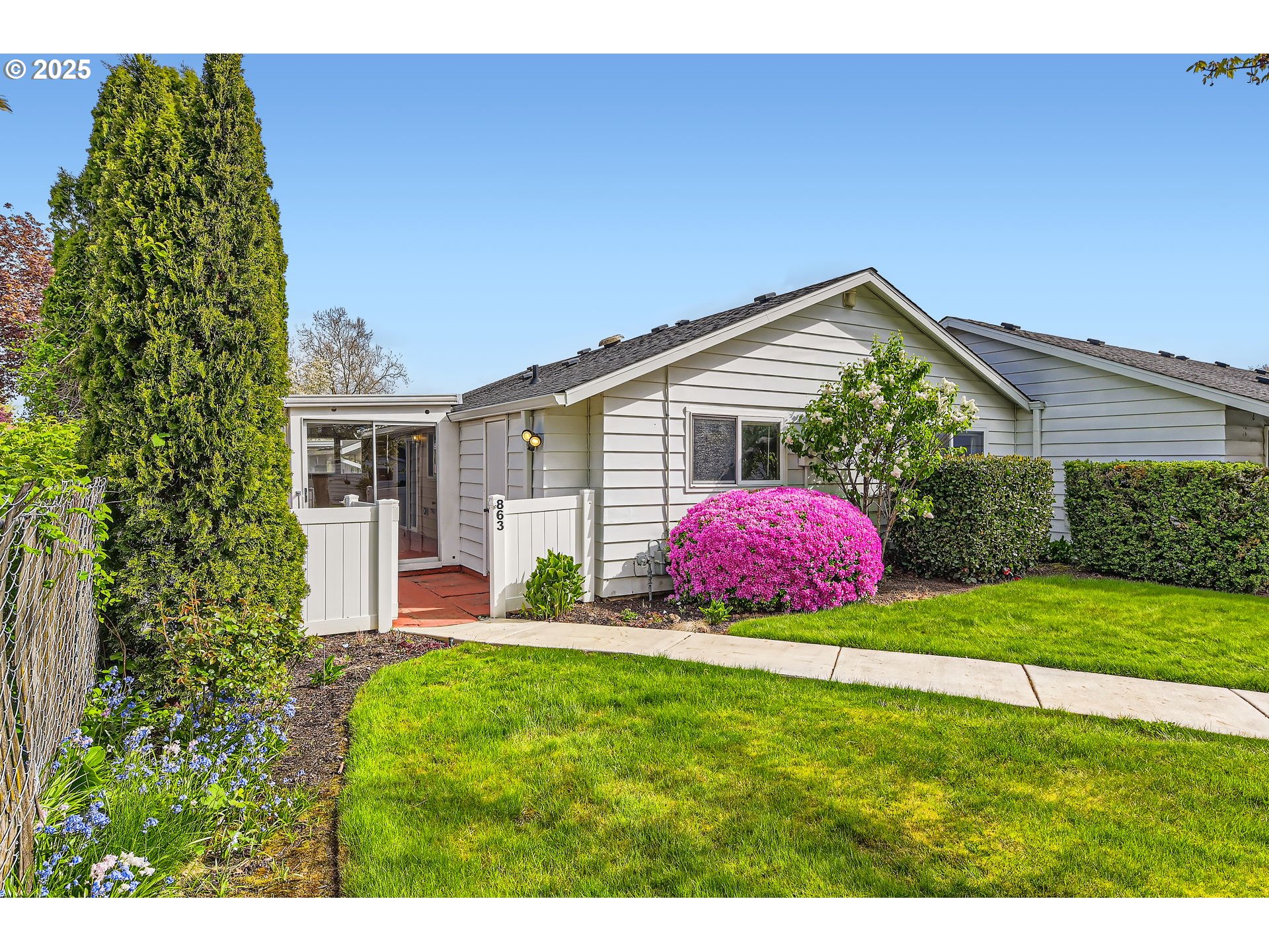 863 Northeast Fleming Avenue, Unit B10 Gresham, OR 97030 - Photo 24 of 38 a front view of a house with a yard and garage