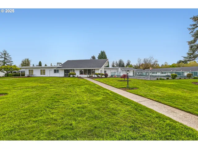 a view of a house with a big yard