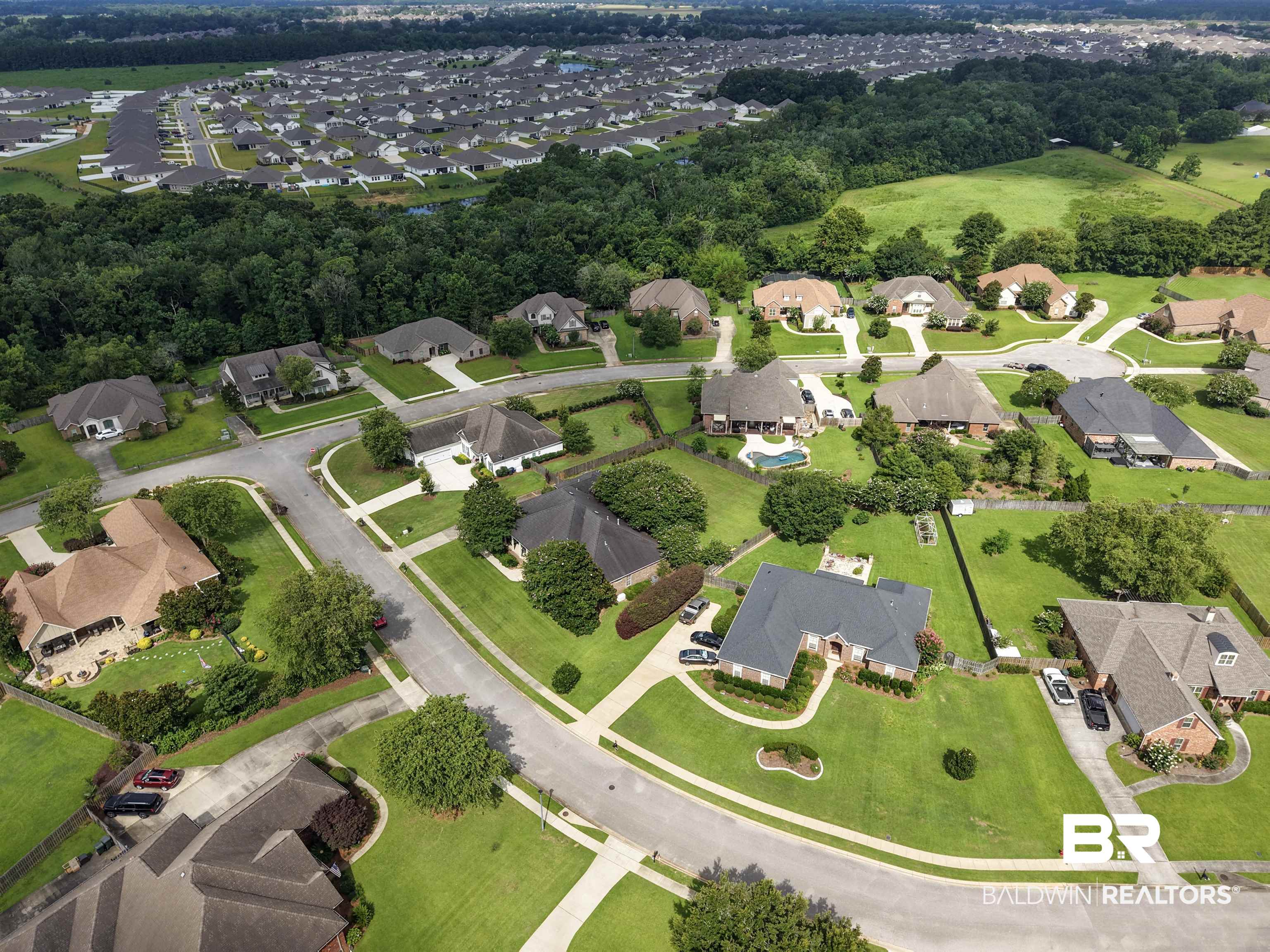 11261 Halcyon Loop Daphne, AL 36526 - Photo 35 of 41 Expansive residential area featuring a variety of single-story and two-story homes with diverse architectural styles, mature landscaping, and private driveways