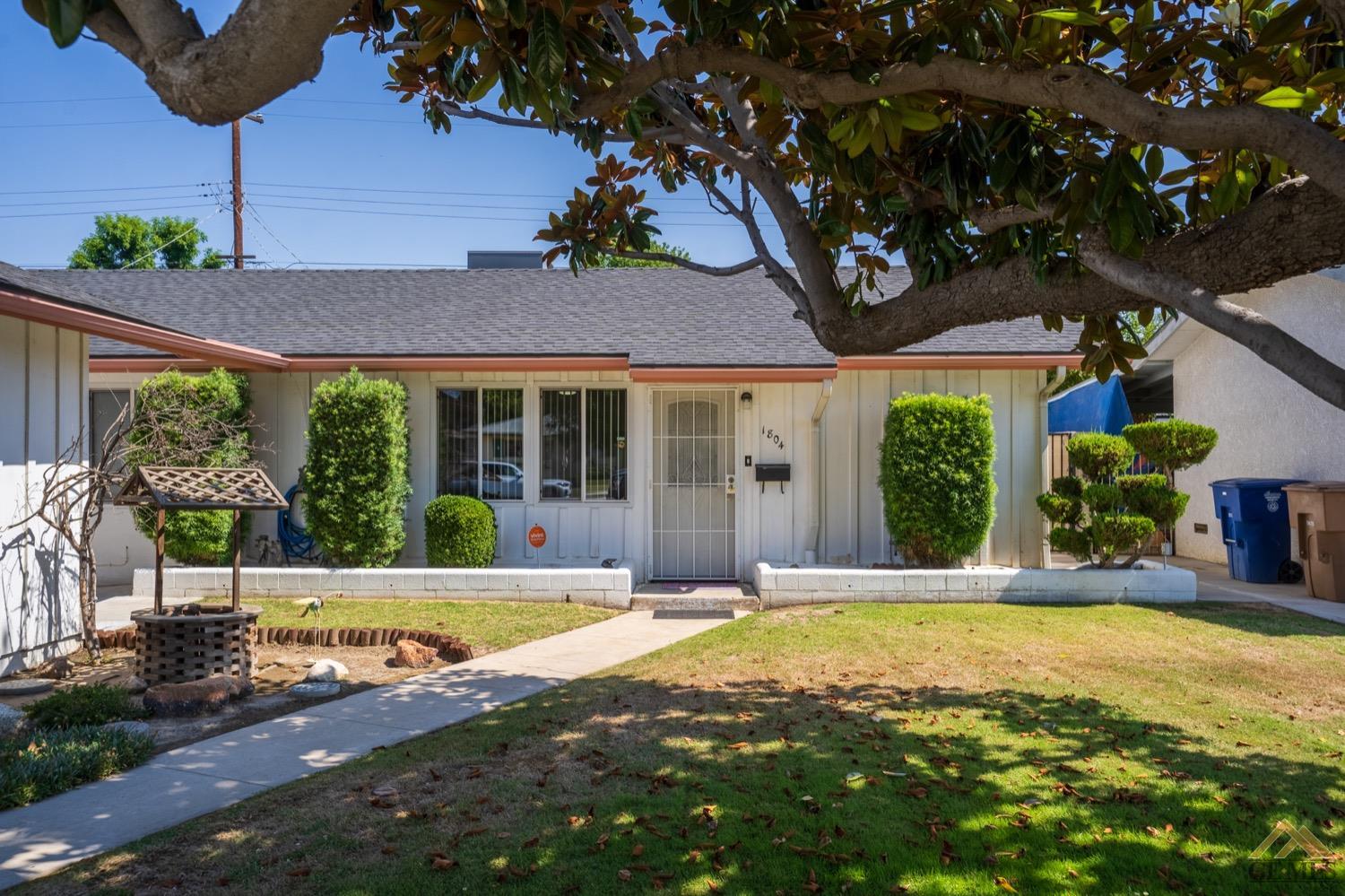 Undisclosed Address Bakersfield, CA 93304 - Photo 1 of 30 a front view of a house with a yard